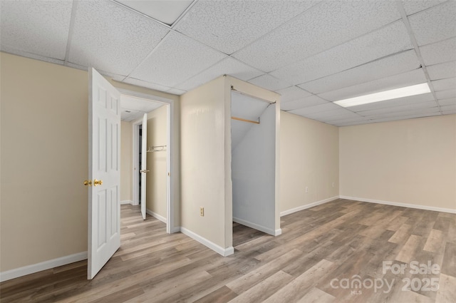 25 Evelake Dr, Asheville, NC 28806 - finished basement with a paneled ceiling, wood finished floors, and baseboards