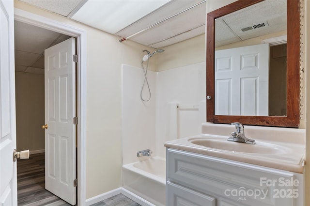 25 Evelake Dr, Asheville, NC 28806 - full bath featuring bathing tub / shower combination, wood finished floors, vanity, a drop ceiling, and baseboards