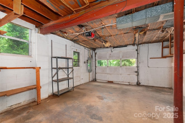 25 Evelake Dr, Asheville, NC 28806 - garage featuring a garage door opener and concrete block wall