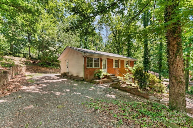 25 Evelake Dr, Asheville, NC 28806 - view of front of home with driveway and brick siding