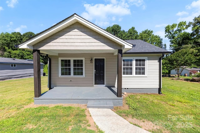 2009 Auten Rd, Gastonia, NC 28054 - bungalow featuring a front yard, a shingled roof, and a porch