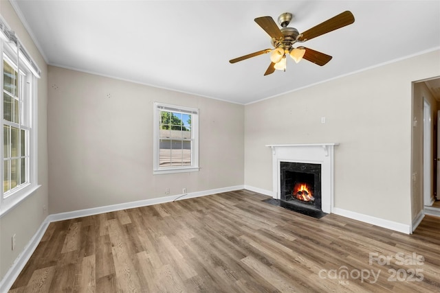 2009 Auten Rd, Gastonia, NC 28054 - unfurnished living room featuring ornamental molding, a high end fireplace, wood finished floors, baseboards, and ceiling fan