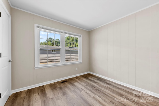 2009 Auten Rd, Gastonia, NC 28054 - empty room featuring wood finished floors, baseboards, and ornamental molding