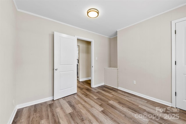 2009 Auten Rd, Gastonia, NC 28054 - spare room featuring wood finished floors, crown molding, and baseboards