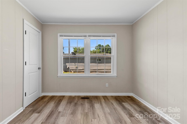 2009 Auten Rd, Gastonia, NC 28054 - empty room with wood finished floors, baseboards, and crown molding