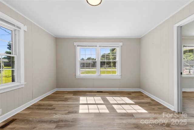 2009 Auten Rd, Gastonia, NC 28054 - unfurnished room with ornamental molding, wood finished floors, and baseboards