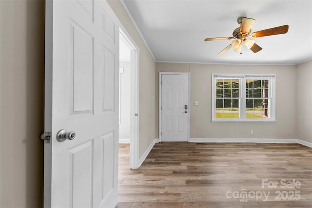 2009 Auten Rd, Gastonia, NC 28054 - entrance foyer with light wood finished floors, ceiling fan, and baseboards