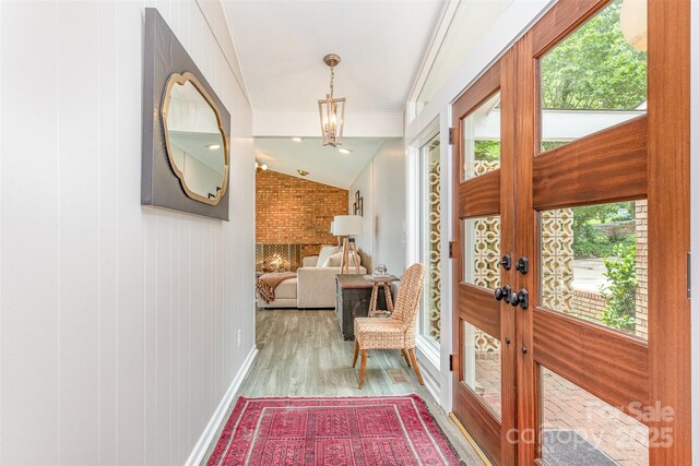 5114 Leisure Ln, Sherrills Ford, NC 28673 - foyer with french doors, wood finished floors, crown molding, baseboards, and a chandelier