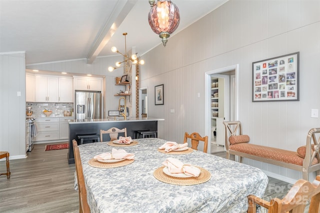 5114 Leisure Ln, Sherrills Ford, NC 28673 - dining area with wood finished floors, beam ceiling, a chandelier, and ornamental molding