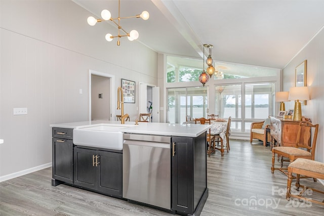 5114 Leisure Ln, Sherrills Ford, NC 28673 - kitchen with stainless steel dishwasher, dark cabinetry, a sink, vaulted ceiling, and light wood-style floors