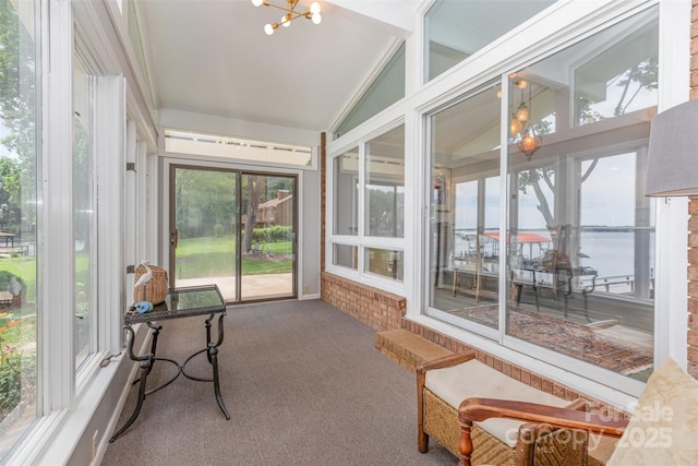 5114 Leisure Ln, Sherrills Ford, NC 28673 - sunroom featuring vaulted ceiling, carpet floors, healthy amount of natural light, a chandelier, and a water view