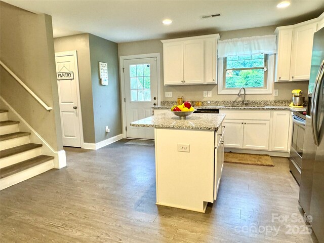 212 Old Centergrove Rd, Kannapolis, NC 28083 - kitchen with a sink, white cabinetry, a kitchen island, and recessed lighting