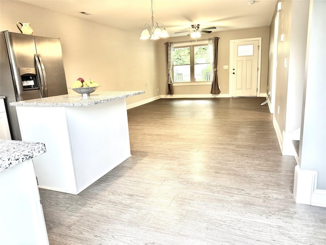 212 Old Centergrove Rd, Kannapolis, NC 28083 - kitchen with stainless steel fridge with ice dispenser, wood finished floors, ceiling fan, and a chandelier