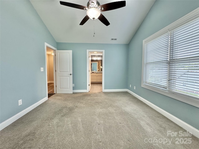 212 Old Centergrove Rd, Kannapolis, NC 28083 - unfurnished bedroom featuring lofted ceiling, carpet flooring, baseboards, ensuite bathroom, and ceiling fan
