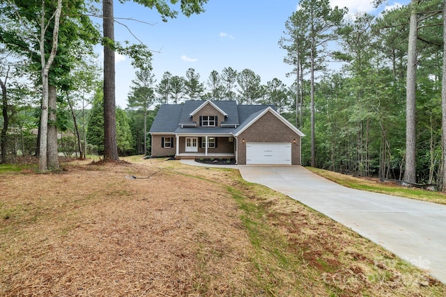 5025 Harbor View Dr E, Granite Falls, NC 28630 - view of front of home with brick siding, concrete driveway, covered porch, and a garage