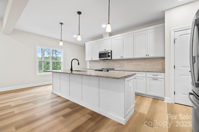 5025 Harbor View Dr E, Granite Falls, NC 28630 - kitchen featuring a sink, appliances with stainless steel finishes, tasteful backsplash, and light wood finished floors