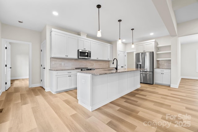 5025 Harbor View Dr E, Granite Falls, NC 28630 - kitchen featuring appliances with stainless steel finishes, a sink, open shelves, decorative backsplash, and baseboards