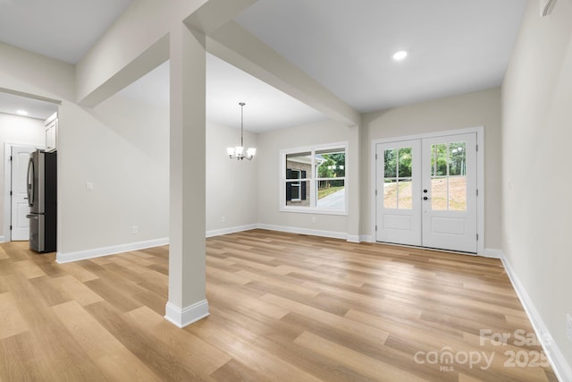 5025 Harbor View Dr E, Granite Falls, NC 28630 - unfurnished living room featuring light wood finished floors, baseboards, a chandelier, and recessed lighting