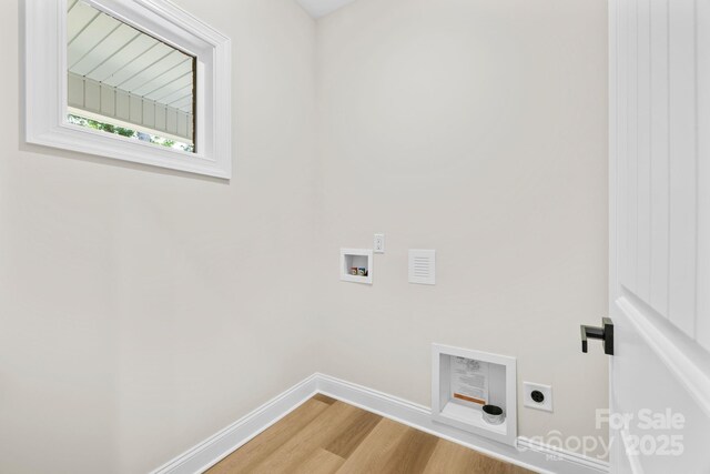 5025 Harbor View Dr E, Granite Falls, NC 28630 - washroom featuring hookup for an electric dryer, hookup for a washing machine, baseboards, and wood finished floors