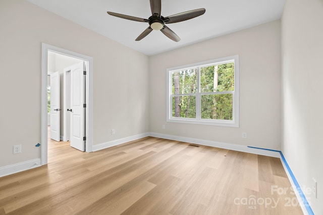 5025 Harbor View Dr E, Granite Falls, NC 28630 - spare room with light wood finished floors, a ceiling fan, and baseboards