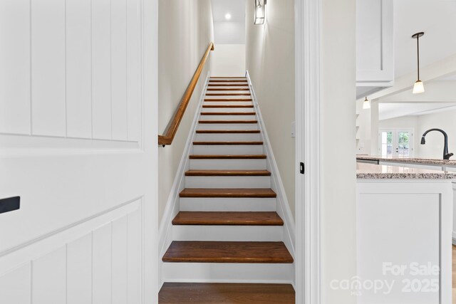 5025 Harbor View Dr E, Granite Falls, NC 28630 - staircase featuring beamed ceiling and wood finished floors