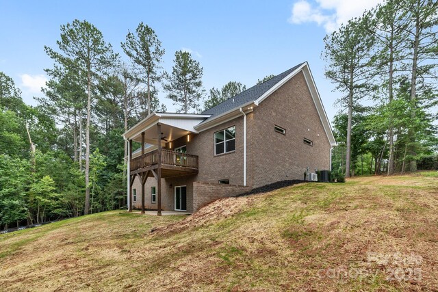 5025 Harbor View Dr E, Granite Falls, NC 28630 - rear view of property featuring ceiling fan, a yard, brick siding, a balcony, and central AC