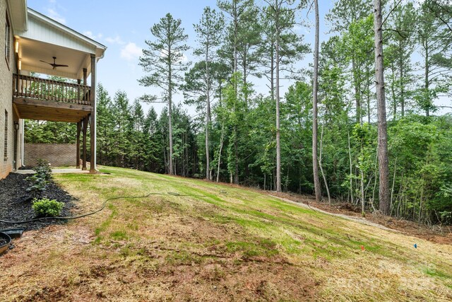 5025 Harbor View Dr E, Granite Falls, NC 28630 - view of green lawn with a ceiling fan and a balcony