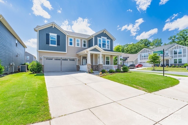 1004 Earlston Rd, Indian Trail, NC 28079 - craftsman-style house with a porch, an attached garage, central AC, stone siding, and concrete driveway