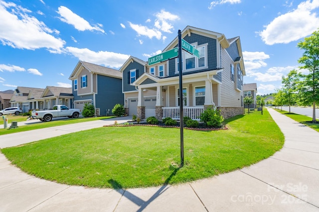 1004 Earlston Rd, Indian Trail, NC 28079 - view of front of property with driveway, covered porch, a front lawn, an attached garage, and a residential view