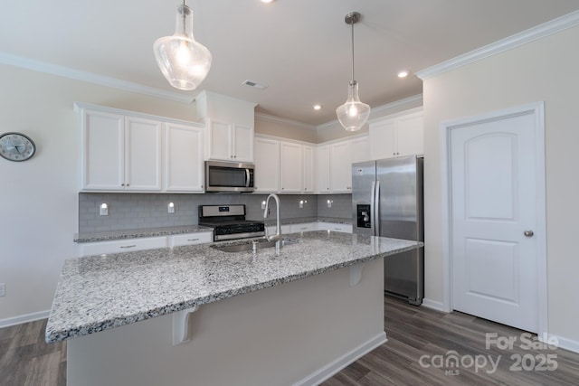 1004 Earlston Rd, Indian Trail, NC 28079 - kitchen with appliances with stainless steel finishes, a sink, white cabinets, backsplash, and dark wood-style floors