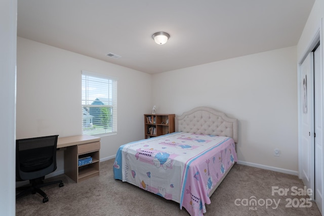 1004 Earlston Rd, Indian Trail, NC 28079 - bedroom featuring carpet floors, baseboards, a closet, and a desk