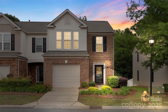 4278 Park S Station Blvd, Charlotte, NC 28210 - view of front of property featuring brick siding, an attached garage, and driveway