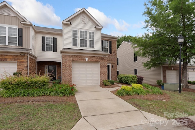 4278 Park S Station Blvd, Charlotte, NC 28210 - view of front of property featuring driveway, an attached garage, and brick siding