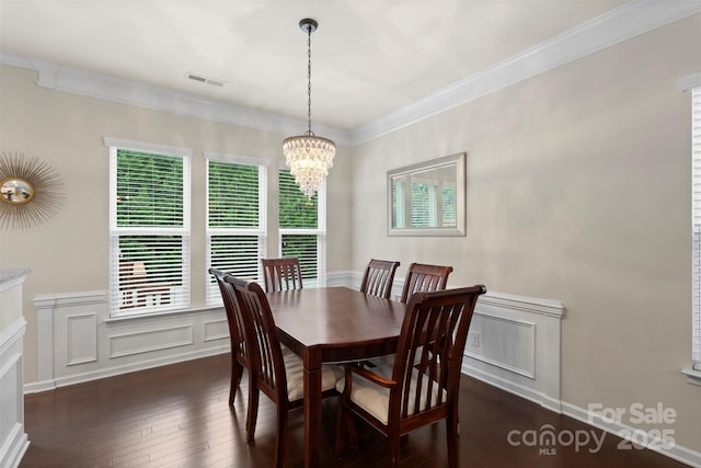 4278 Park S Station Blvd, Charlotte, NC 28210 - dining space with dark wood-type flooring, a chandelier, crown molding, wainscoting, and a decorative wall