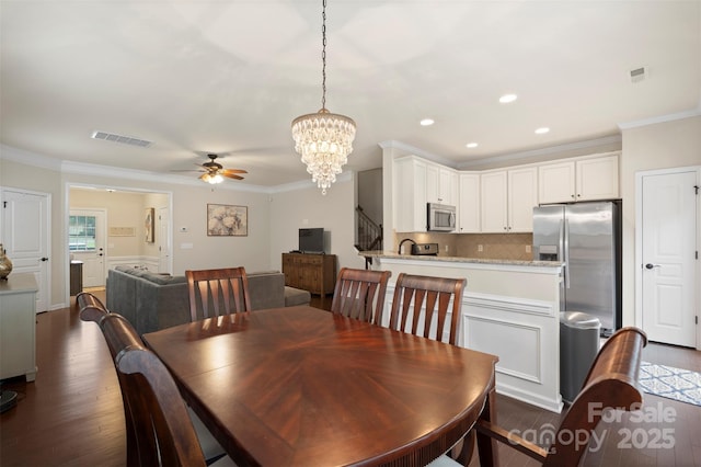 4278 Park S Station Blvd, Charlotte, NC 28210 - dining area featuring dark wood-type flooring, a ceiling fan, crown molding, a chandelier, and recessed lighting