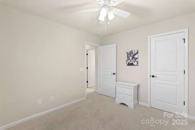 4278 Park S Station Blvd, Charlotte, NC 28210 - unfurnished bedroom featuring light colored carpet, baseboards, and a ceiling fan