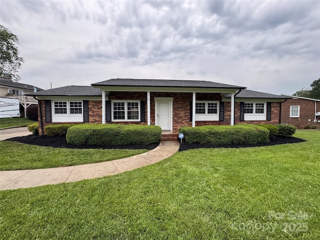1735 Hollandale Dr, Gastonia, NC 28054 - ranch-style house with brick siding and a front lawn