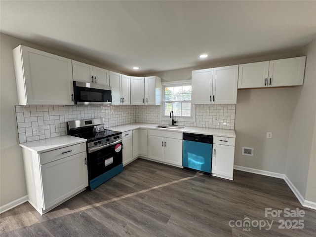 1735 Hollandale Dr, Gastonia, NC 28054 - kitchen featuring stainless steel appliances, a sink, white cabinetry, decorative backsplash, and recessed lighting