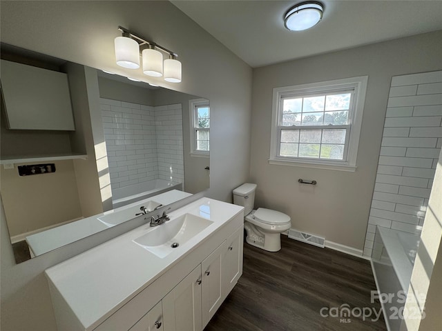 1735 Hollandale Dr, Gastonia, NC 28054 - full bath featuring vanity, toilet, wood finished floors, and shower / bath combination