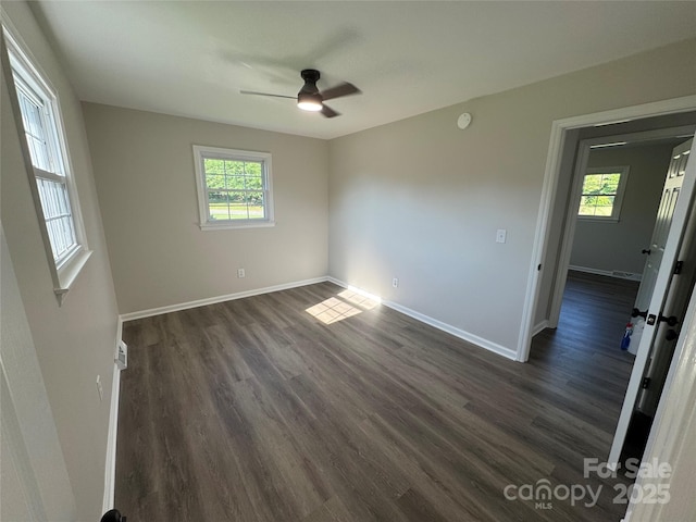 1735 Hollandale Dr, Gastonia, NC 28054 - unfurnished room with a ceiling fan, dark wood-style floors, and baseboards