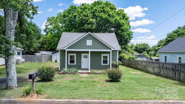 639 S Eastway Dr, Troutman, NC 28166 - bungalow-style house with a porch, roof with shingles, and central AC unit