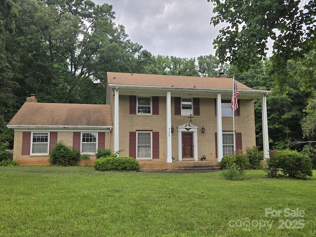 9225 Robinson Church Rd, Charlotte, NC 28215 - greek revival house featuring brick siding and a front yard