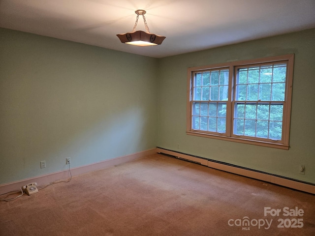 9225 Robinson Church Rd, Charlotte, NC 28215 - empty room featuring a baseboard heating unit and carpet