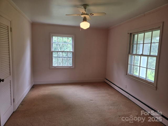 9225 Robinson Church Rd, Charlotte, NC 28215 - empty room featuring baseboard heating, light colored carpet, ornamental molding, and ceiling fan