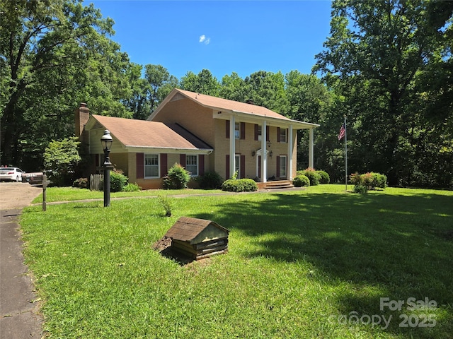 9225 Robinson Church Rd, Charlotte, NC 28215 - greek revival inspired property with a chimney and a front lawn