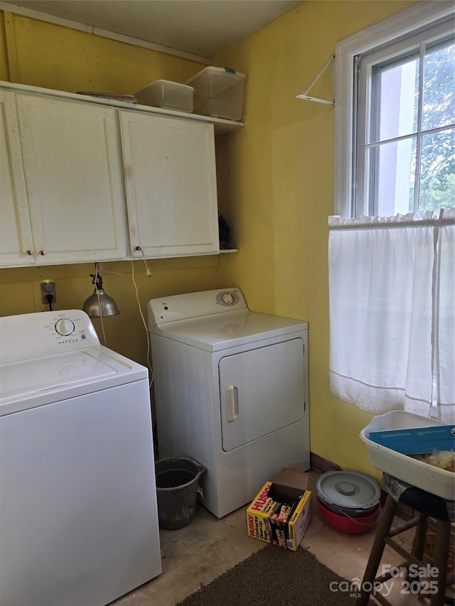 9225 Robinson Church Rd, Charlotte, NC 28215 - laundry room with washer and dryer and cabinet space