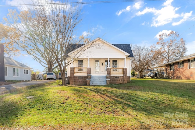 1102 Venus St, Kannapolis, NC 28083 - bungalow-style home with covered porch, asphalt driveway, a front lawn, and crawl space