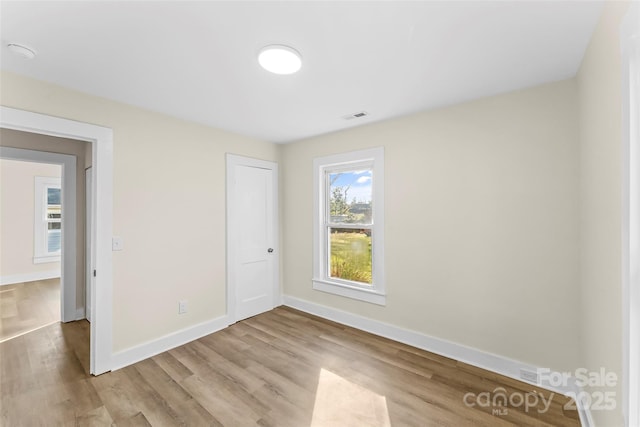 1102 Venus St, Kannapolis, NC 28083 - unfurnished bedroom featuring wood finished floors, baseboards, and a closet
