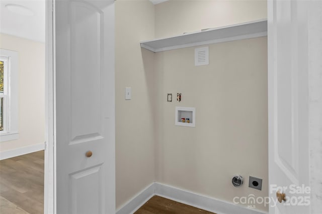 1102 Venus St, Kannapolis, NC 28083 - washroom featuring hookup for an electric dryer, hookup for a washing machine, baseboards, and dark wood-type flooring