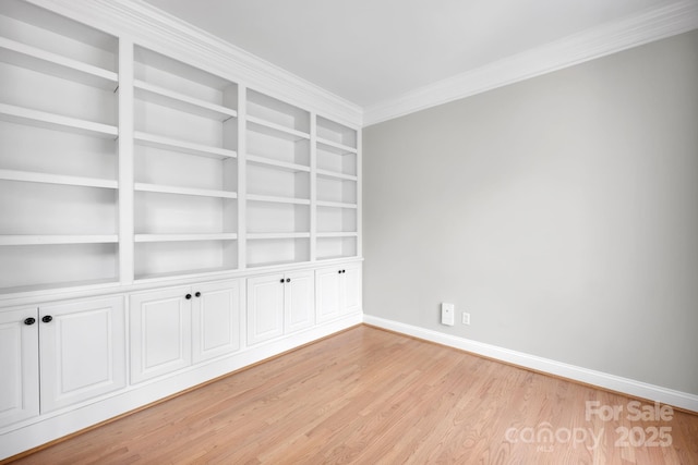 12711 Duncourtney Ln, Charlotte, NC 28277 - empty room featuring light wood-type flooring, baseboards, built in features, and crown molding